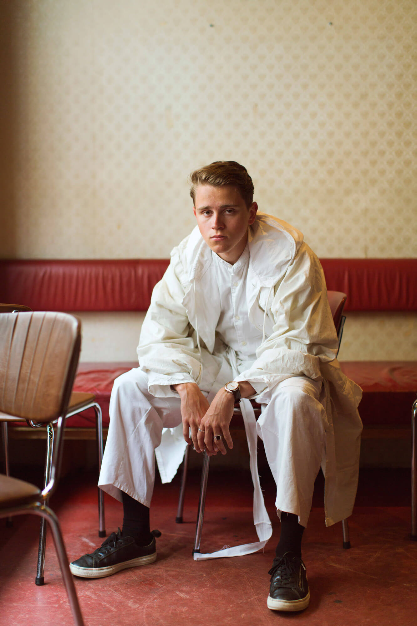 Young man wearing white